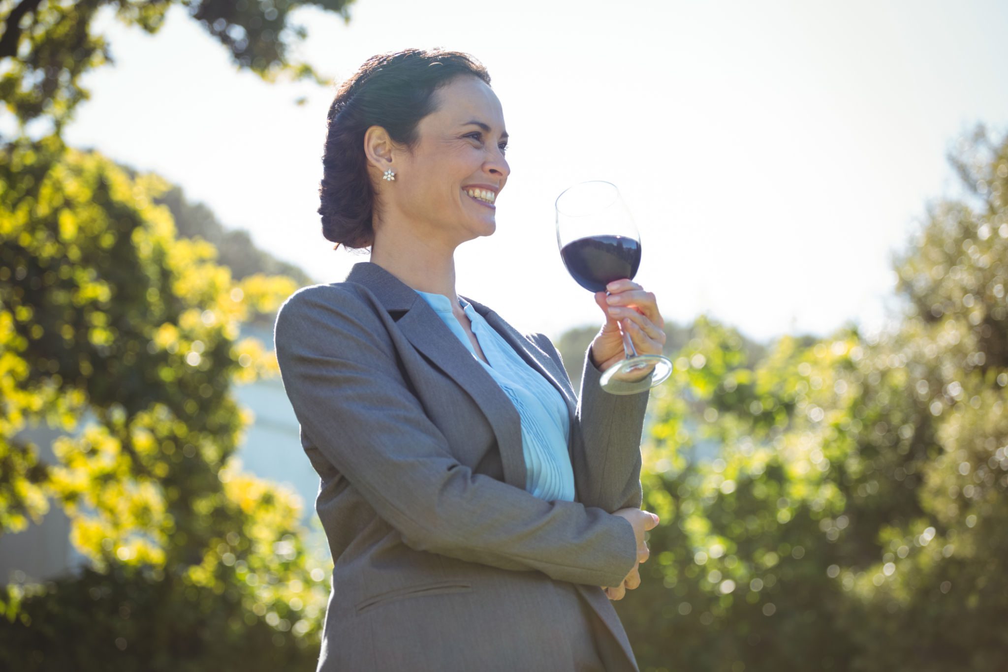 Smiling woman holding wine glass